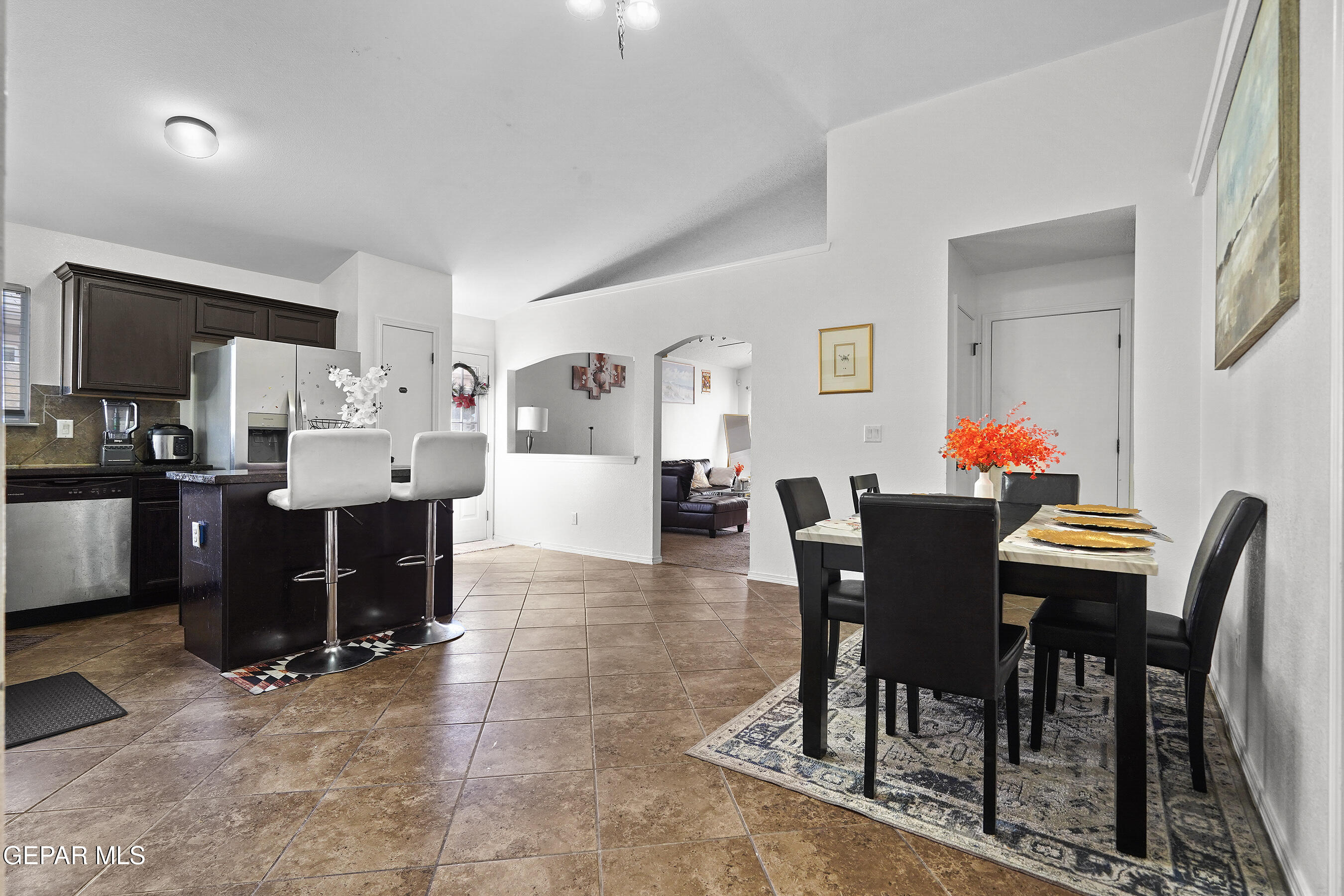 12733 Raul Mendiola Lane El Paso, TX 79938 - Photo 20 of 30 a living room with furniture a dining table and a dining table