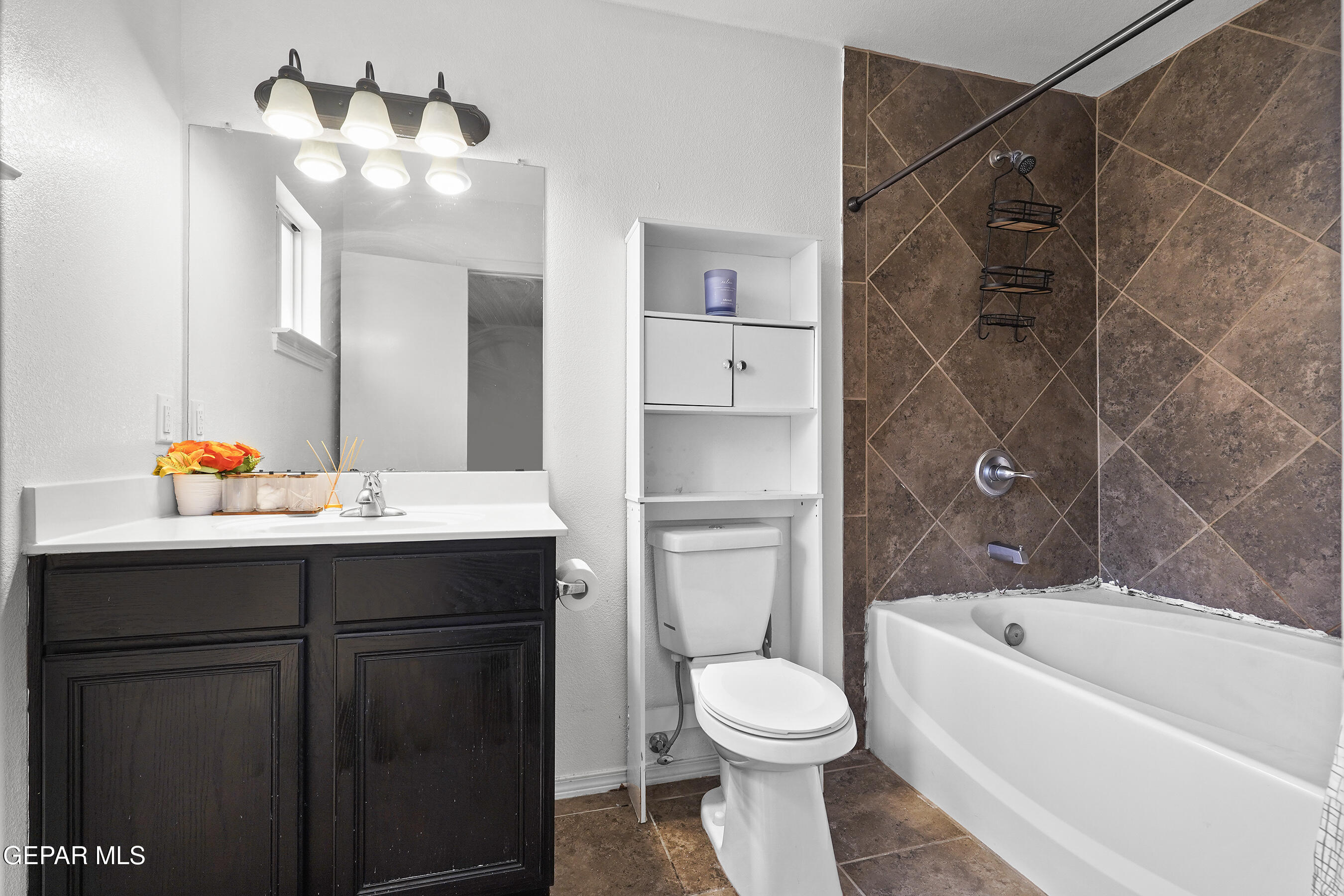 12733 Raul Mendiola Lane El Paso, TX 79938 - Photo 24 of 30 a bathroom with a sink and a mirror