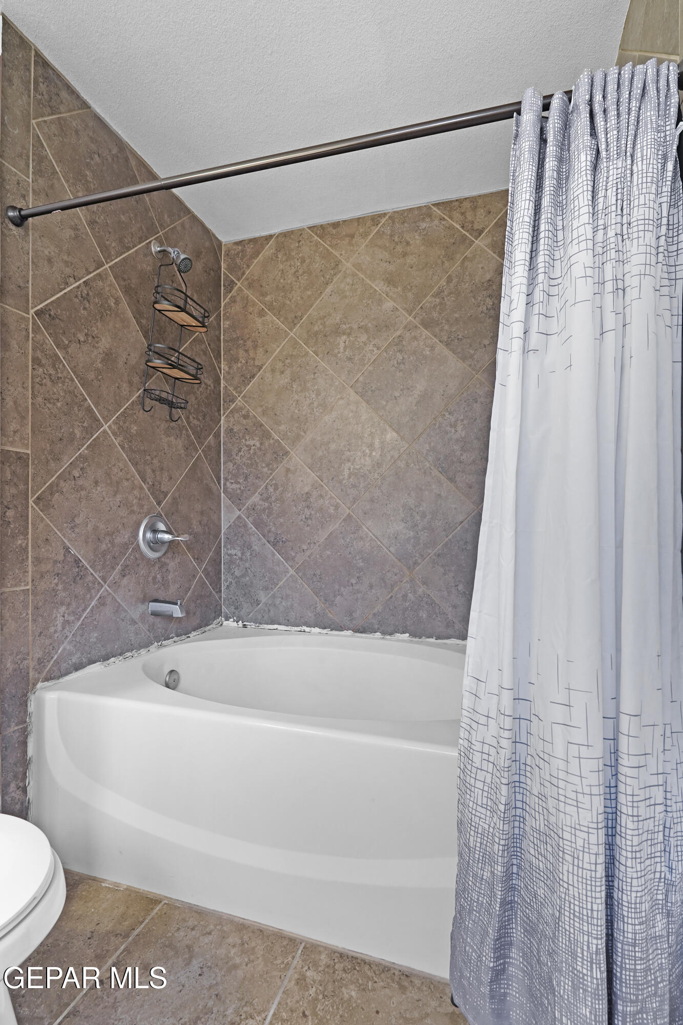 12733 Raul Mendiola Lane El Paso, TX 79938 - Photo 25 of 30 a bathroom with a shower and a toilet
