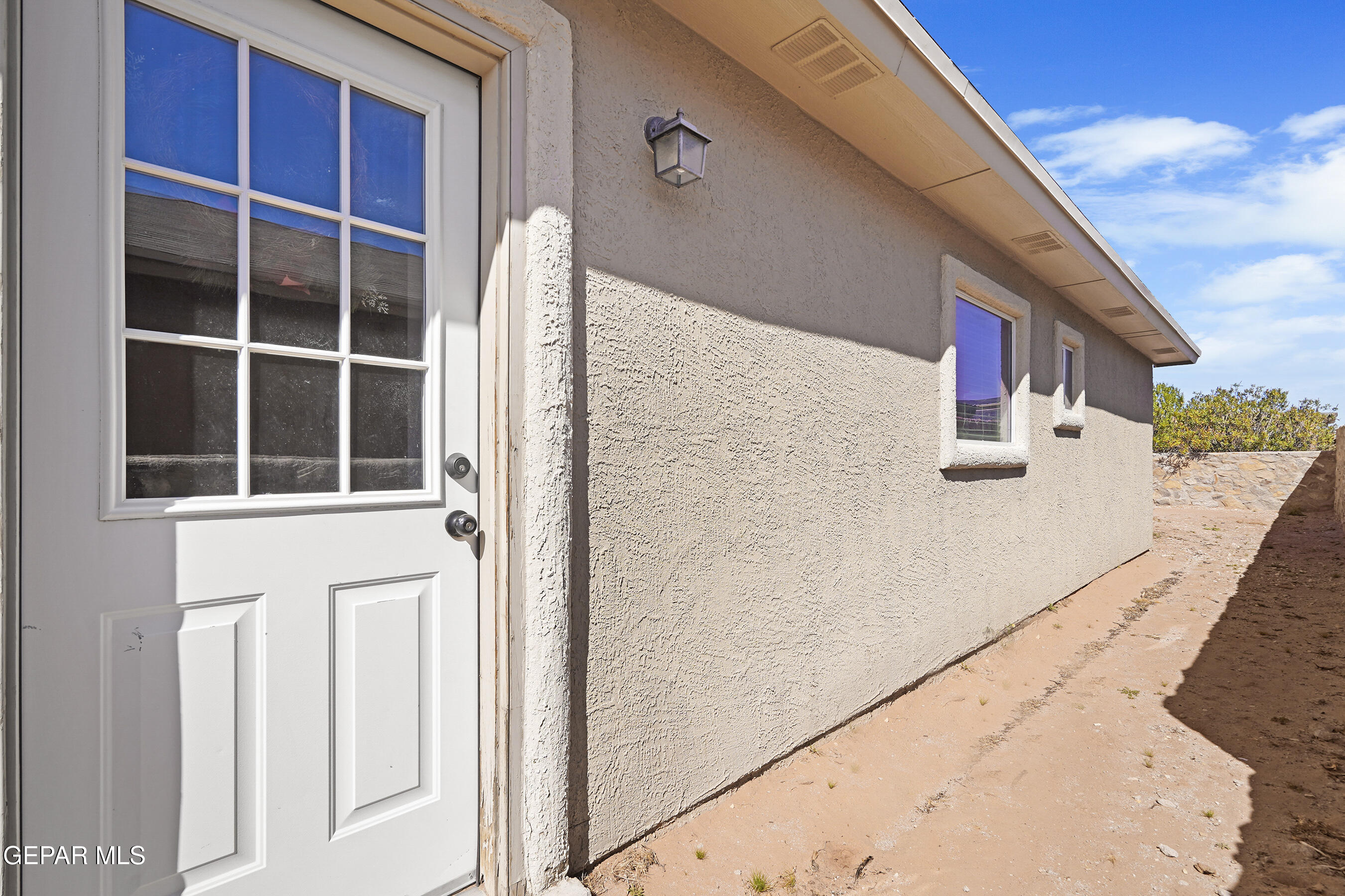 12733 Raul Mendiola Lane El Paso, TX 79938 - Photo 26 of 30 a house view with a front door
