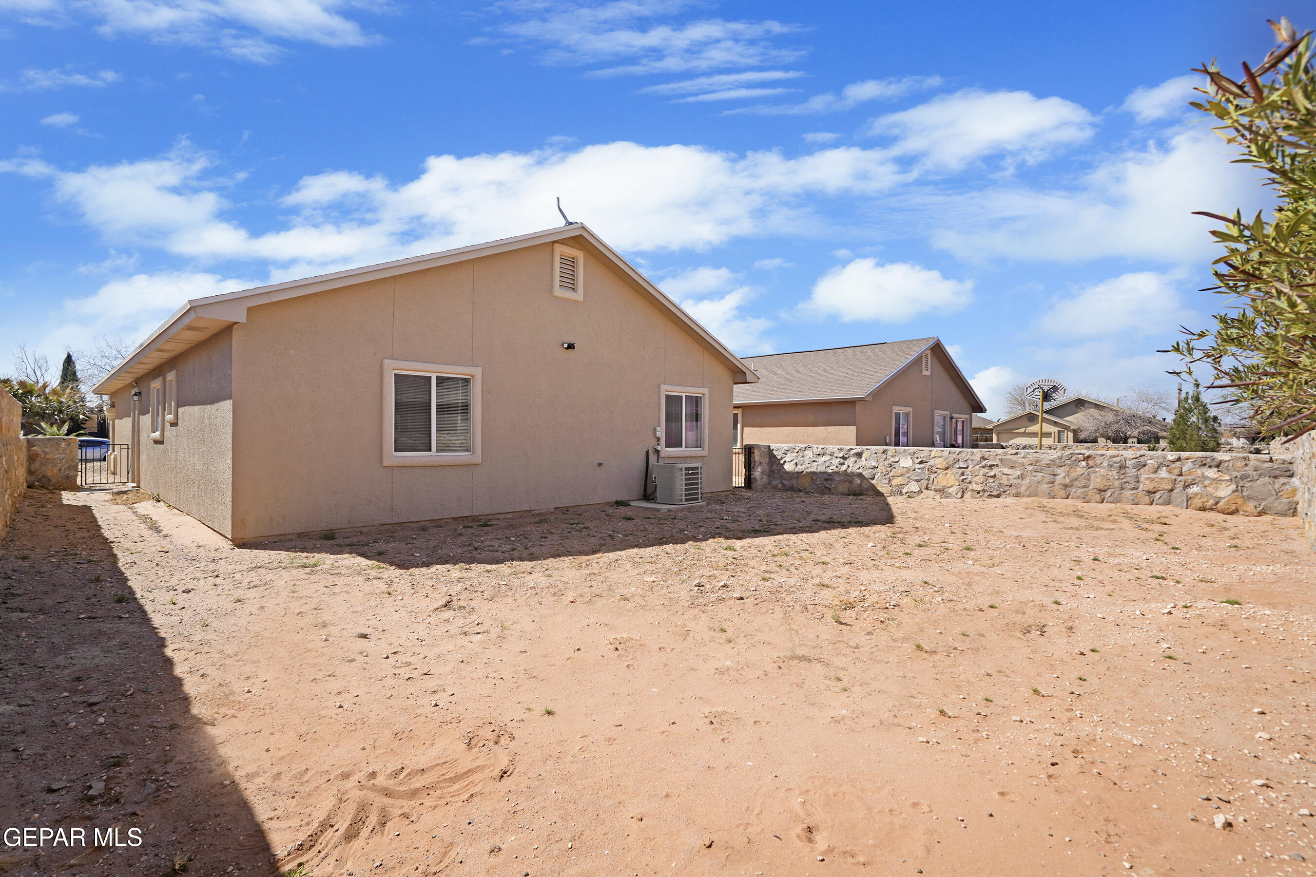 12733 Raul Mendiola Lane El Paso, TX 79938 - Photo 28 of 30 a view of house with wooden fence