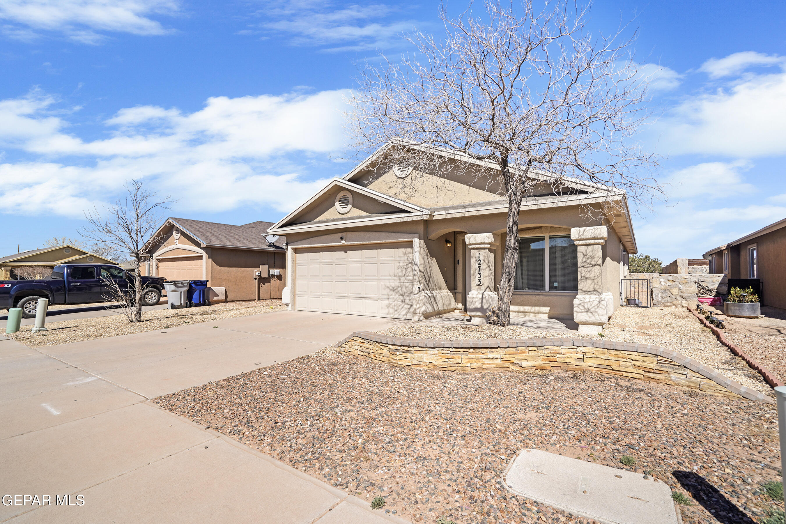 12733 Raul Mendiola Lane El Paso, TX 79938 - Photo 3 of 30 a view of a house with snow on the background