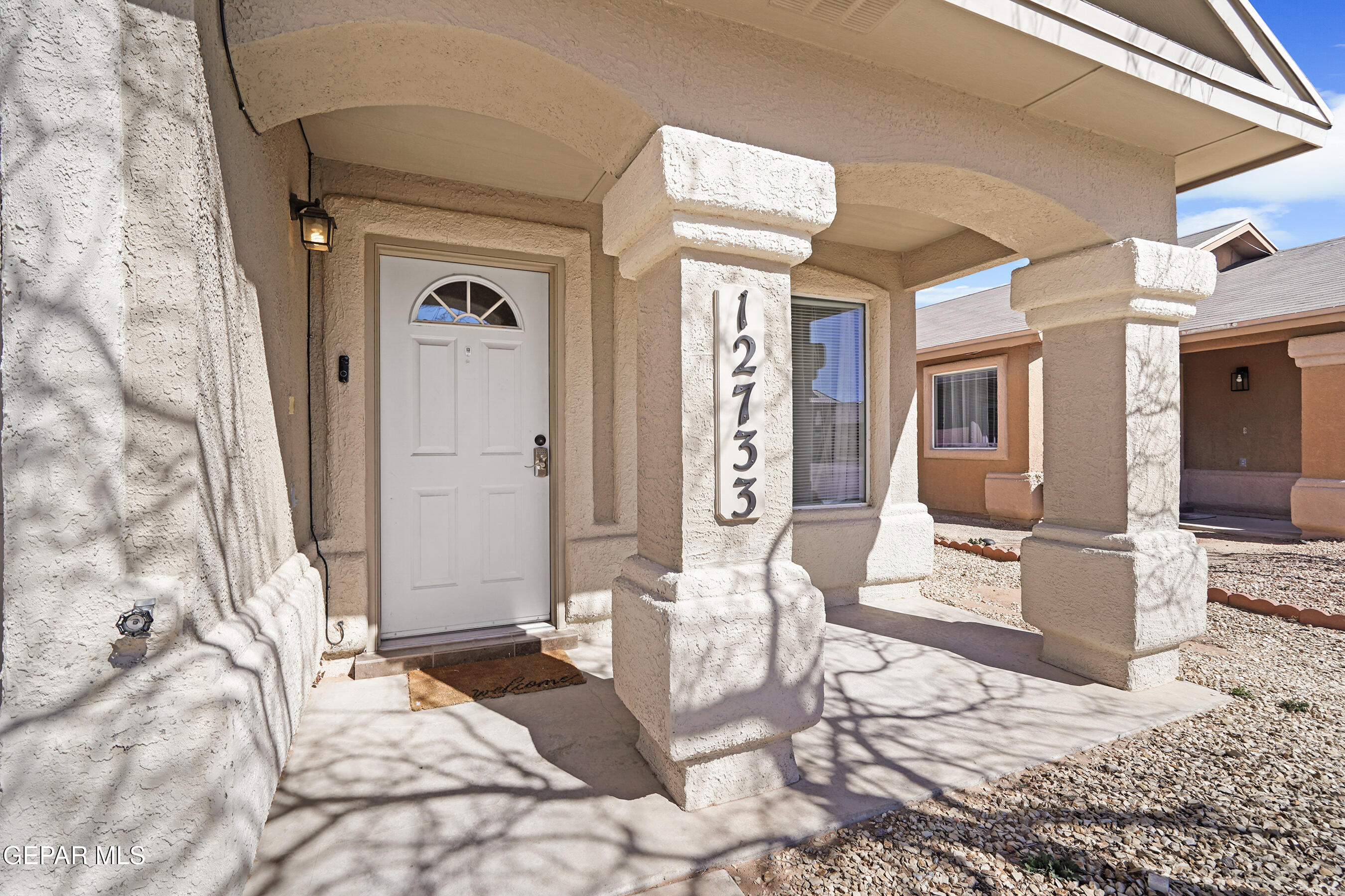 12733 Raul Mendiola Lane El Paso, TX 79938 - Photo 4 of 30 a bedroom with a bed and a couch
