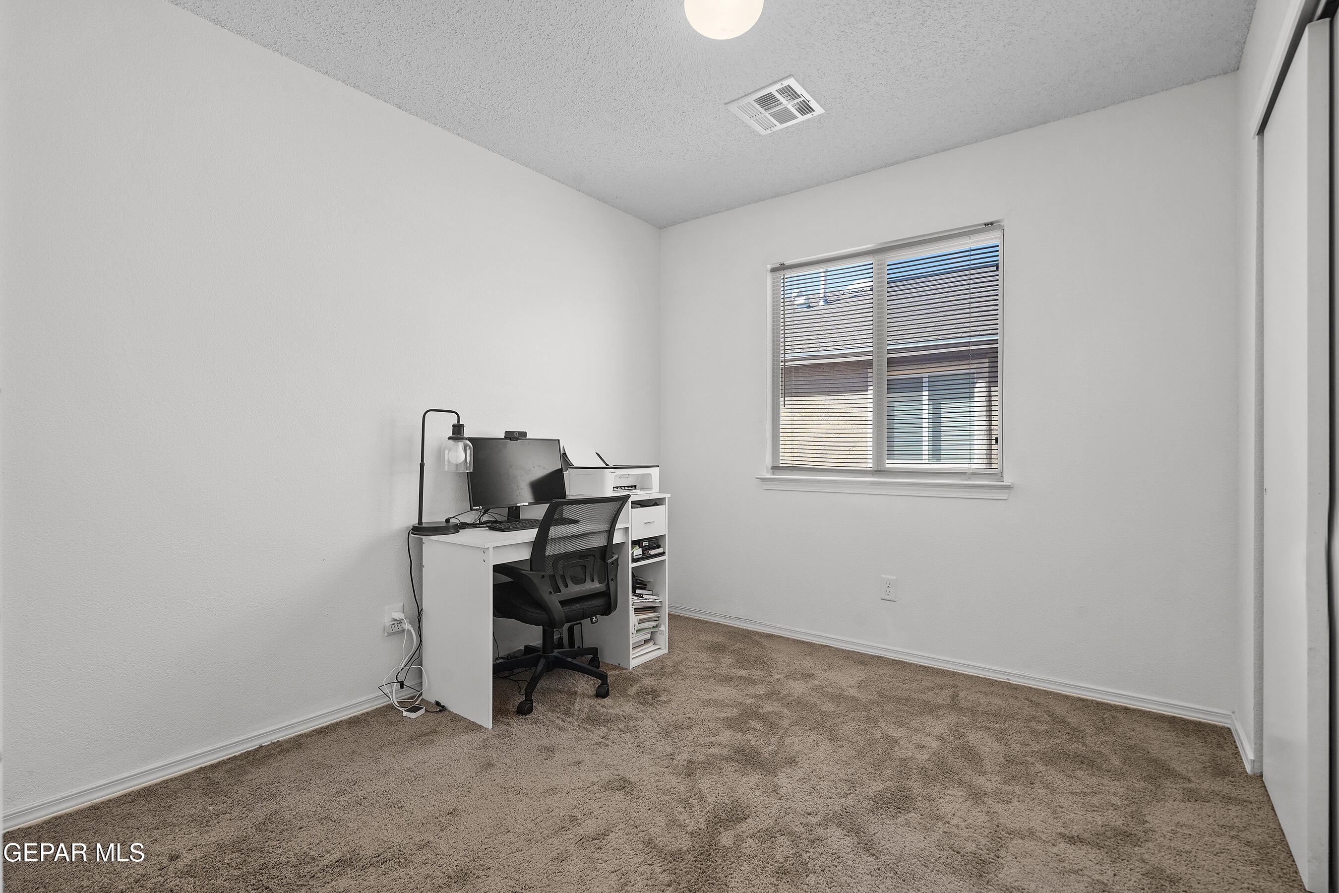 12733 Raul Mendiola Lane El Paso, TX 79938 - Photo 8 of 30 a view of a workspace with furniture