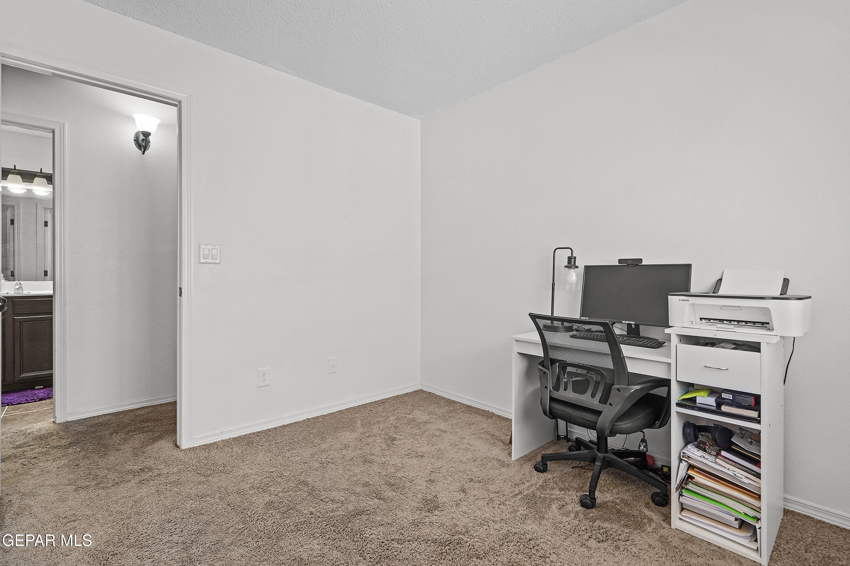 12733 Raul Mendiola Lane El Paso, TX 79938 - Photo 9 of 30 a view of a workspace with furniture