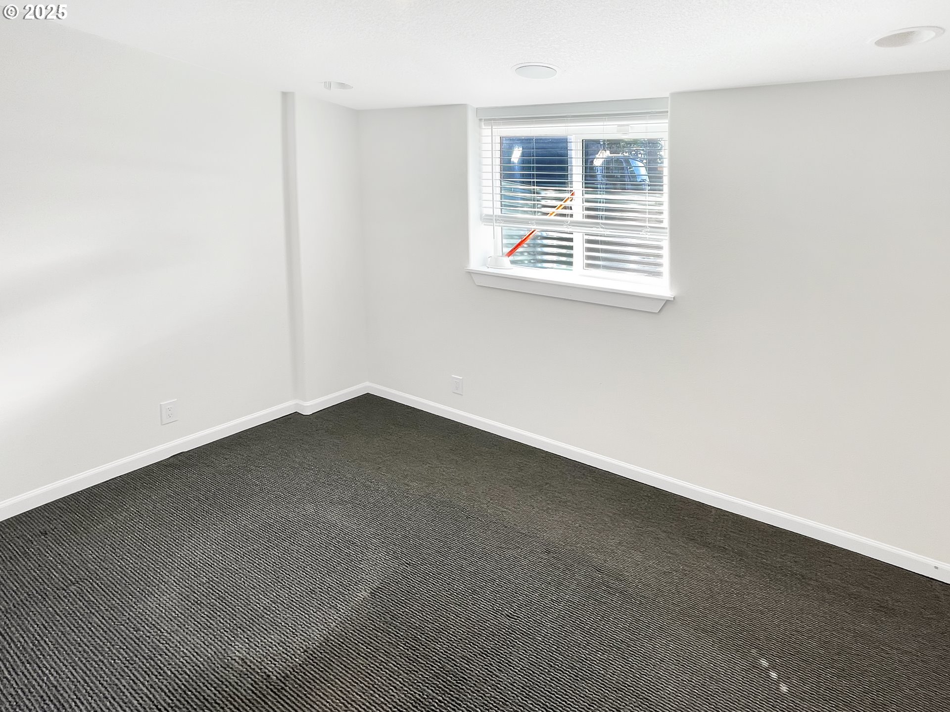 4535 Southwest Laurelwood Avenue Portland, OR 97225 - Photo 6 of 10 an empty room with a window
