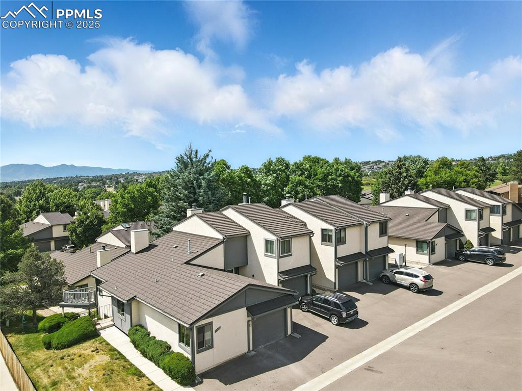 an aerial view of residential houses and city street