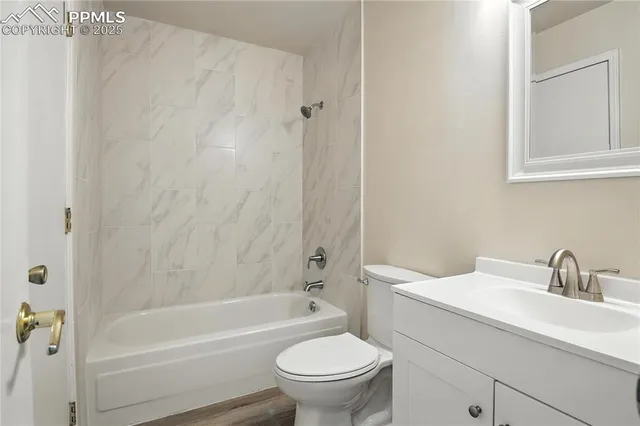 a bathroom with a sink a toilet and a bathtub