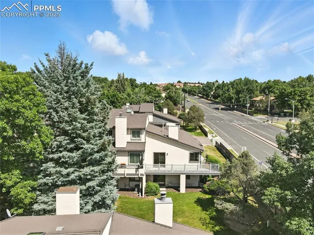 a aerial view of a house with a garden