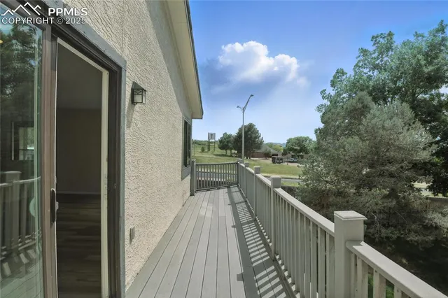a view of balcony and yard