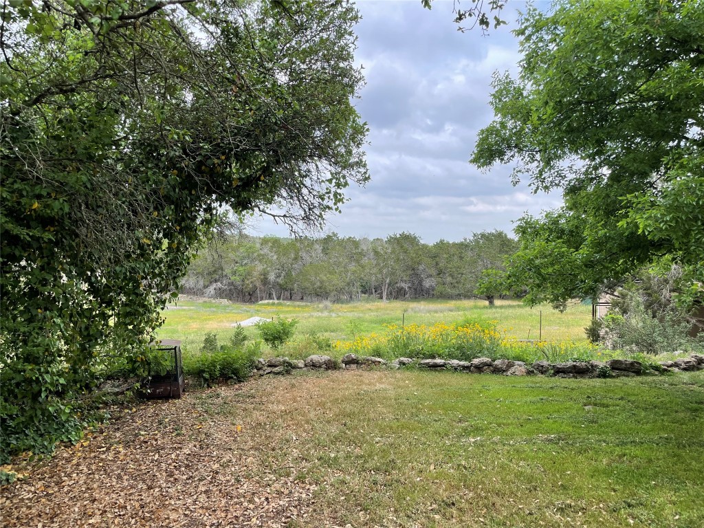 175 Fischer Trail Wimberley, TX 78676 - Photo 26 of 33 a view of a lake from a yard