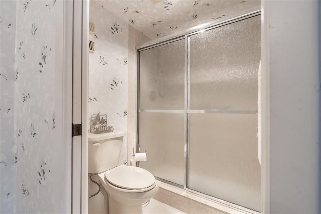 15075 Witney Road, Unit A303 Delray Beach, FL 33484 - Photo 12 of 26 a bathroom with a shower and a toilet