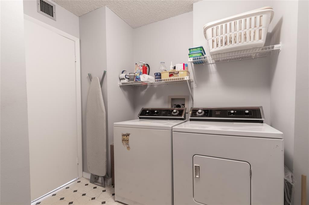 15075 Witney Road, Unit A303 Delray Beach, FL 33484 - Photo 13 of 26 a utility room with dryer and washer