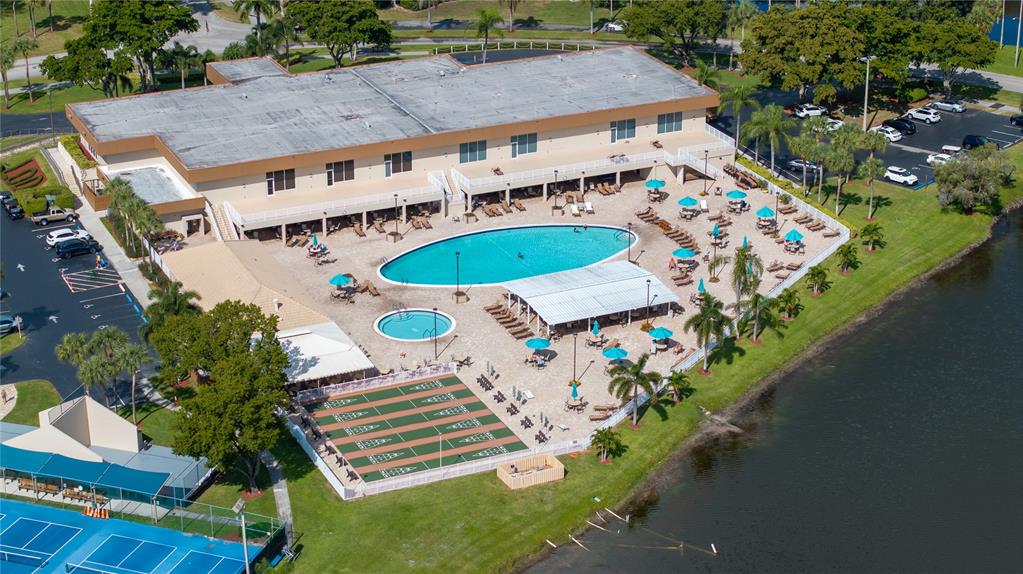 15075 Witney Road, Unit A303 Delray Beach, FL 33484 - Photo 15 of 26 an aerial view of a house with a swimming pool patio and outdoor seating