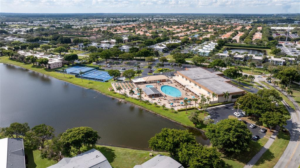 15075 Witney Road, Unit A303 Delray Beach, FL 33484 - Photo 16 of 26 an aerial view of residential houses with outdoor space