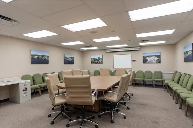 a view of a livingroom with furniture and a dining table