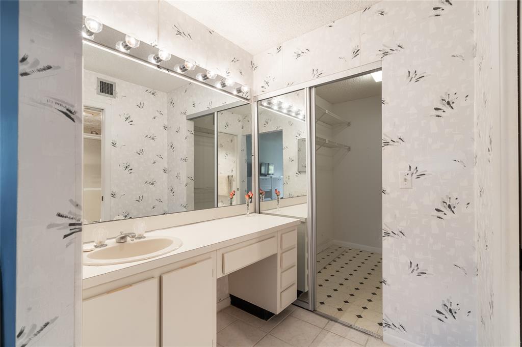 15075 Witney Road, Unit A303 Delray Beach, FL 33484 - Photo 9 of 26 a bathroom with a sink shower and a mirror