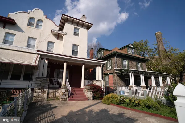 a front view of a house with a porch