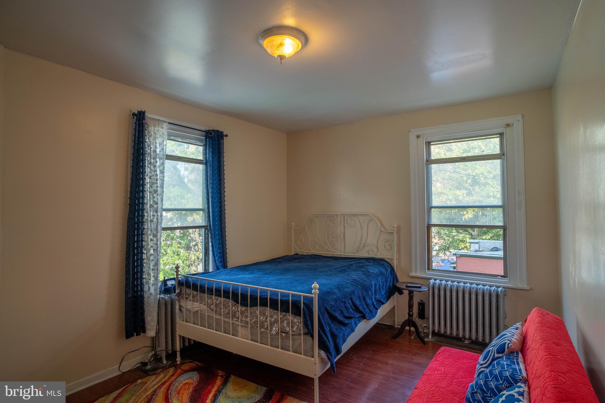1227 Harrison Street Philadelphia, PA 19124 - Photo 15 of 38 a bedroom with a bed and window