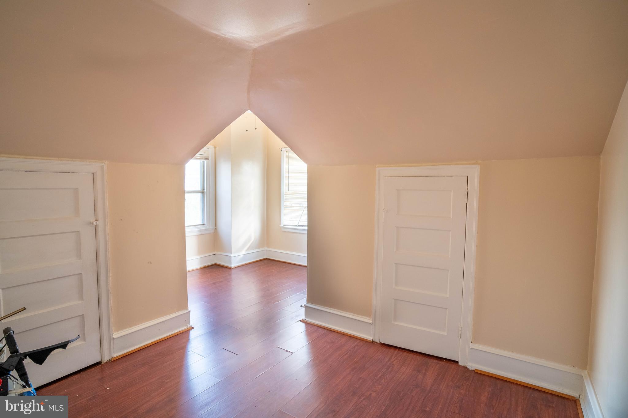 1227 Harrison Street Philadelphia, PA 19124 - Photo 17 of 38 an empty room with wooden floor and windows