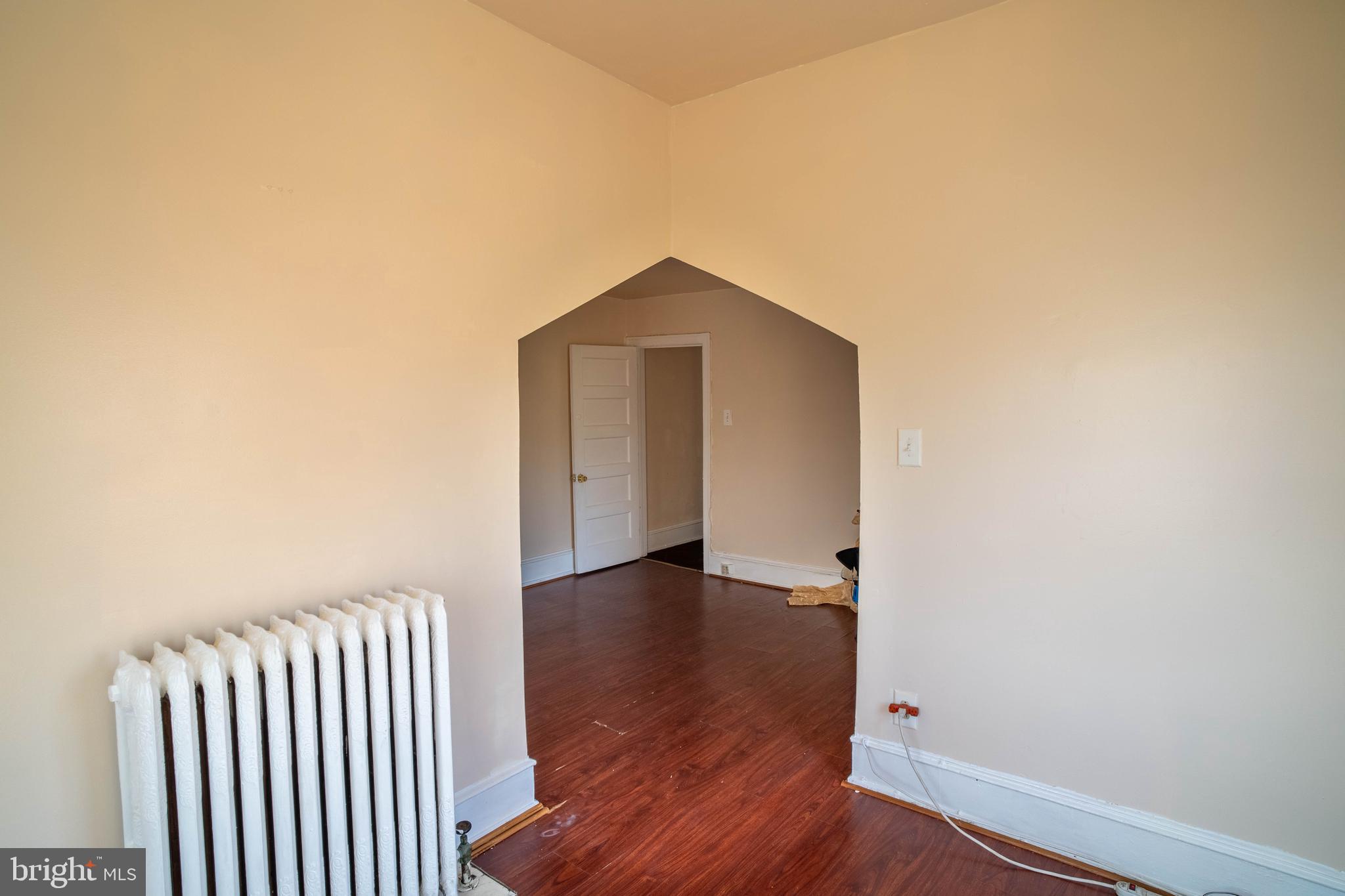 1227 Harrison Street Philadelphia, PA 19124 - Photo 18 of 38 an empty room with wooden floor and closet