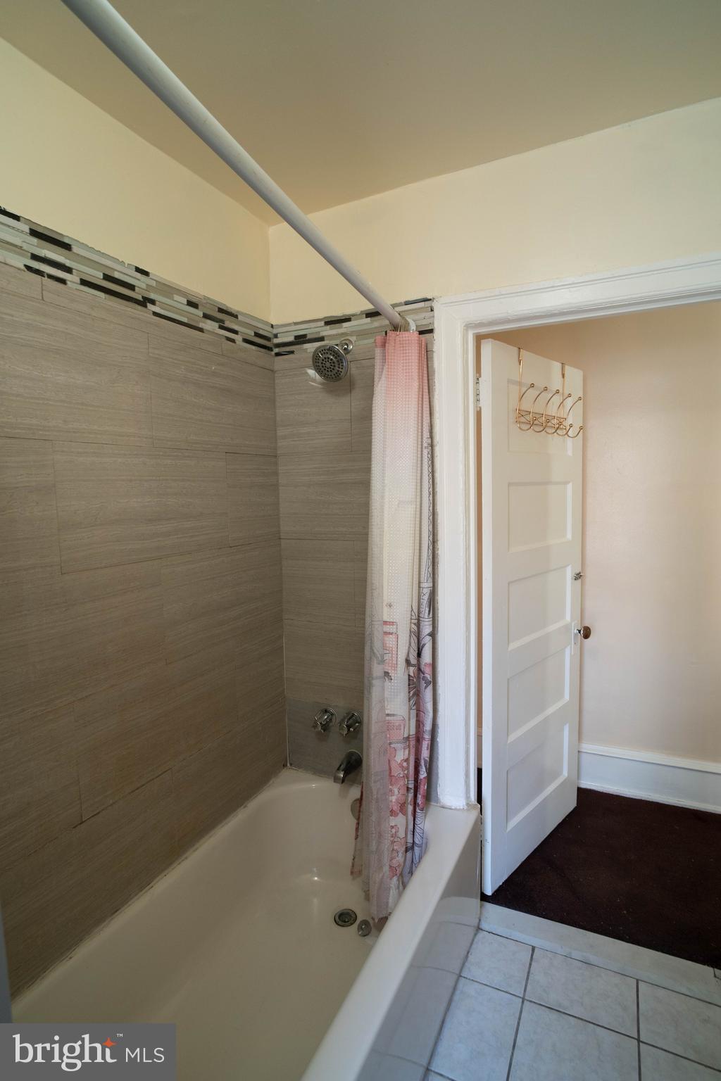 1227 Harrison Street Philadelphia, PA 19124 - Photo 20 of 38 a bathroom with a bathtub and a shower
