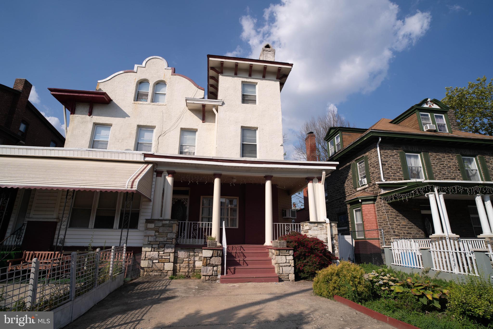 1227 Harrison Street Philadelphia, PA 19124 - Photo 2 of 38 a front view of a house with balcony