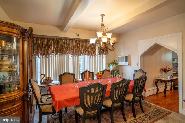 a dining room with furniture and window