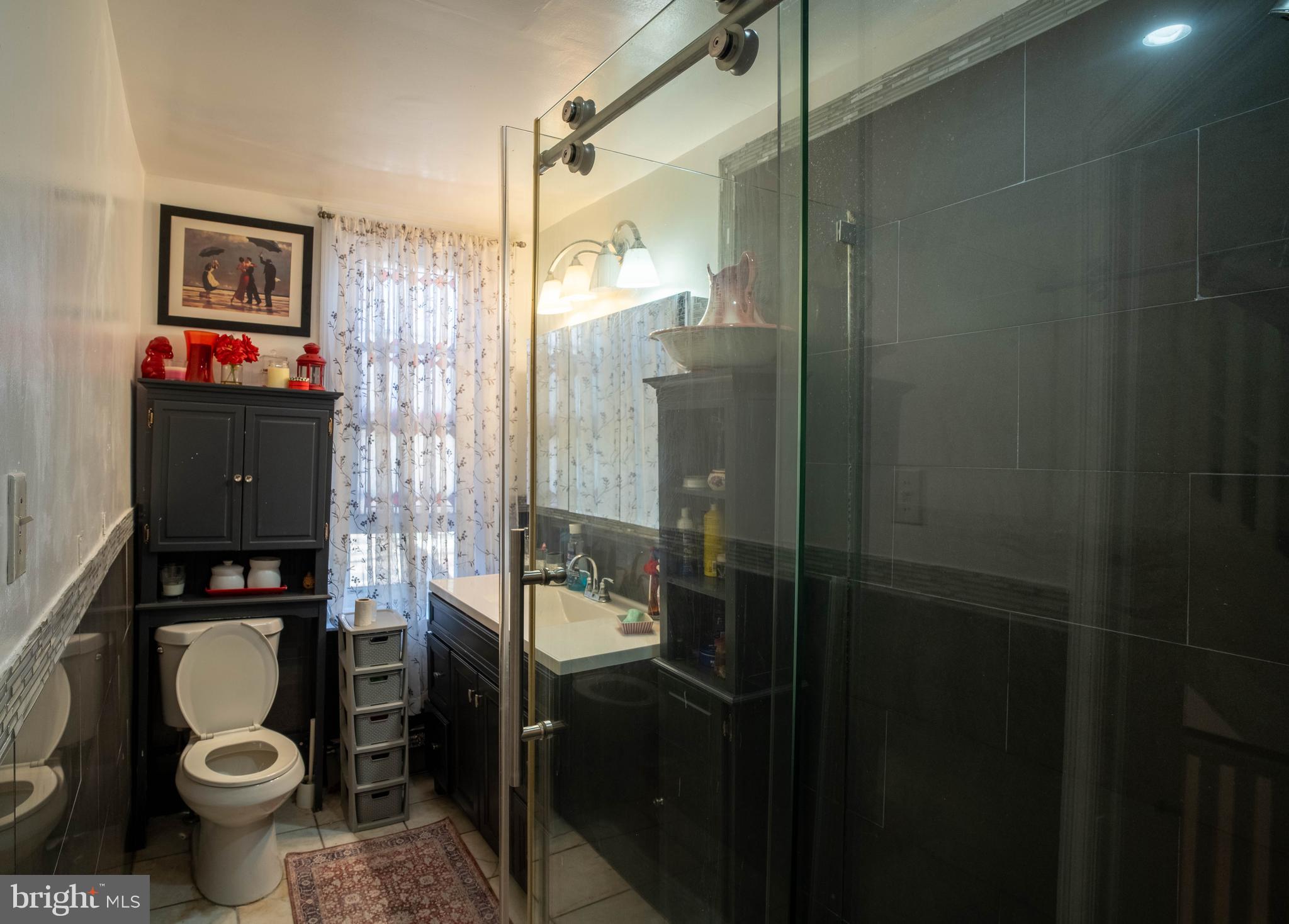 1227 Harrison Street Philadelphia, PA 19124 - Photo 30 of 38 a bathroom with a toilet and a shower