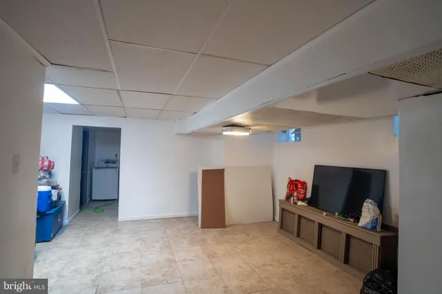 a livingroom with furniture and a flat screen tv