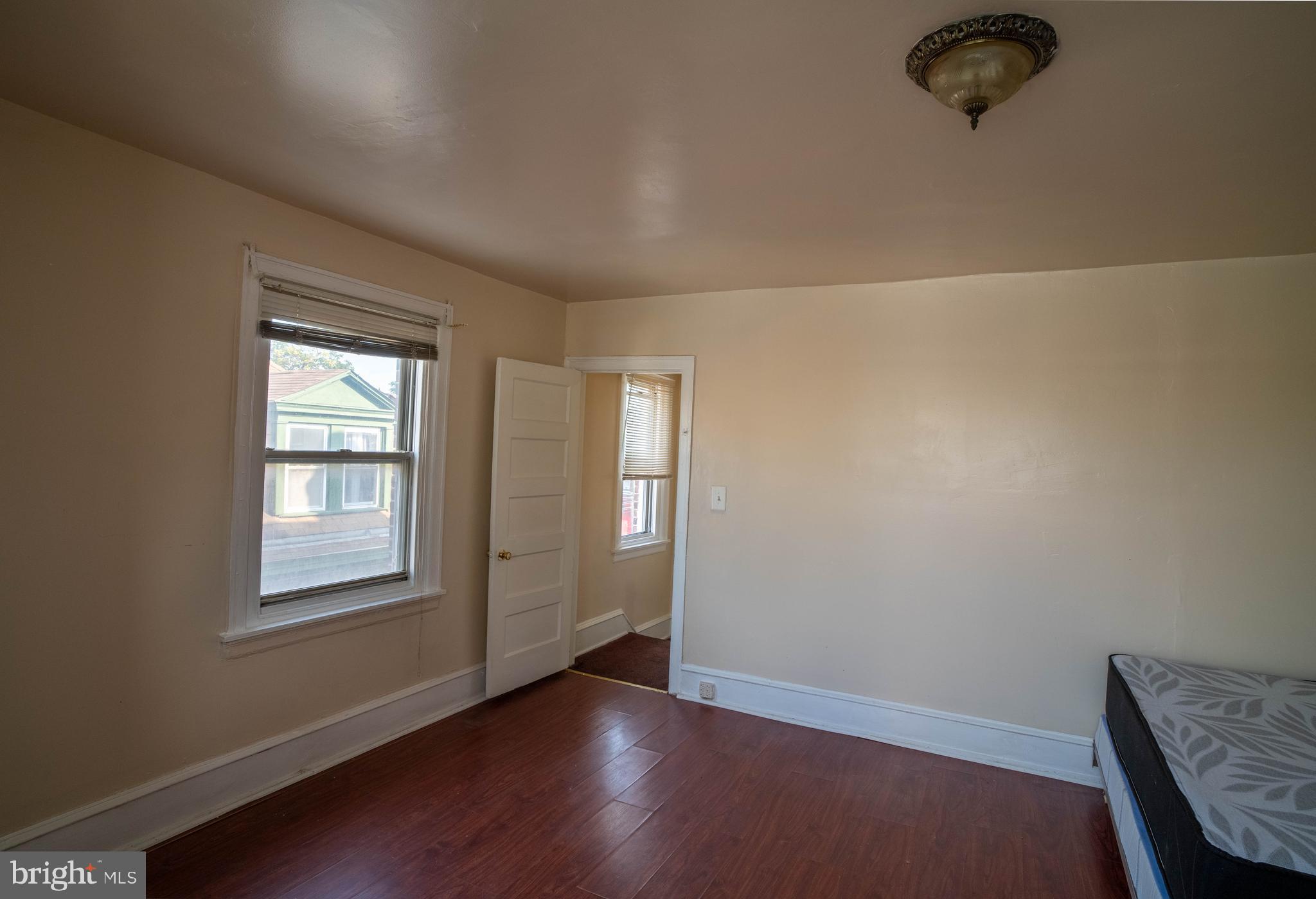 1227 Harrison Street Philadelphia, PA 19124 - Photo 34 of 38 an empty room with windows