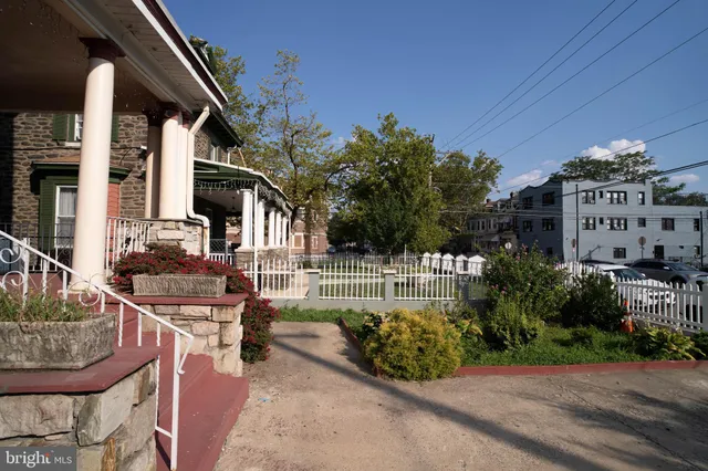 a view of a patio with table and chairs and potted plants