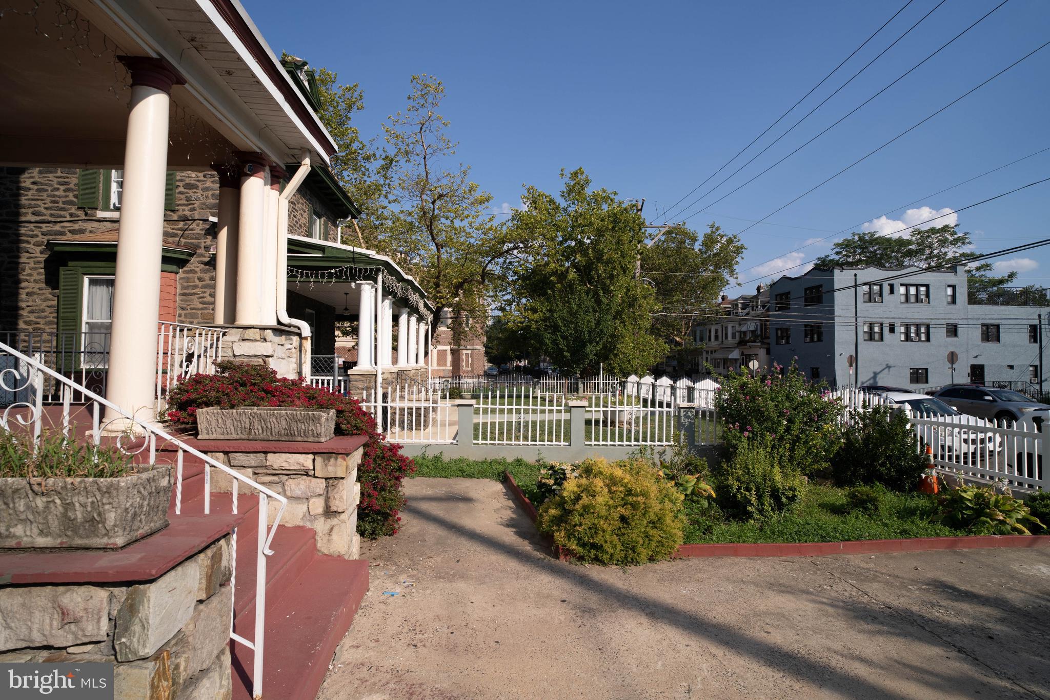 1227 Harrison Street Philadelphia, PA 19124 - Photo 38 of 38 a view of a patio with table and chairs and potted plants