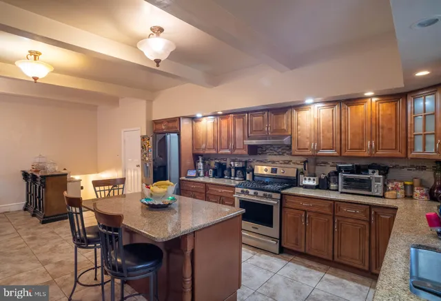 a kitchen with lots of counter top space and appliances