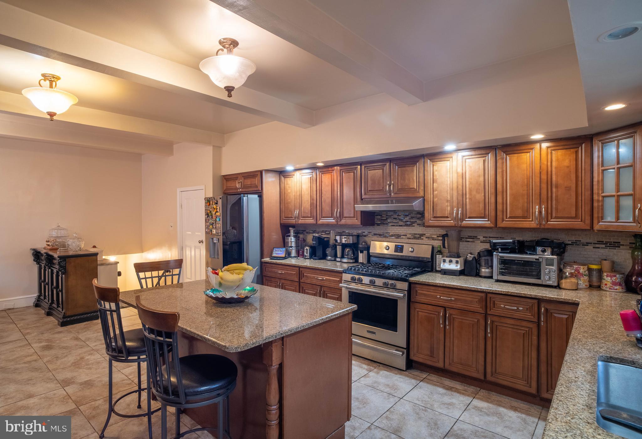 1227 Harrison Street Philadelphia, PA 19124 - Photo 10 of 38 a kitchen with lots of counter top space and appliances