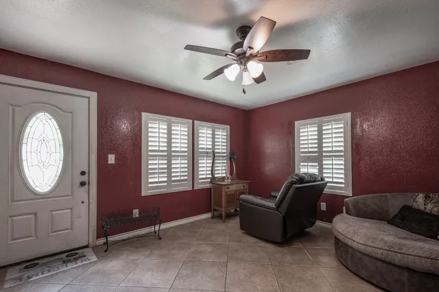 a living room with furniture and a window