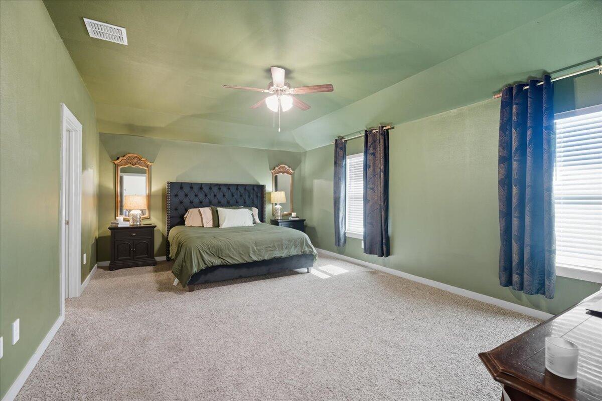 2309 149th Street Lubbock, TX 79423 - Photo 15 of 31 a bedroom with a bed and a window