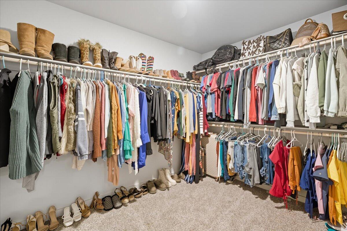 2309 149th Street Lubbock, TX 79423 - Photo 19 of 31 a view of walk in closet with clothes