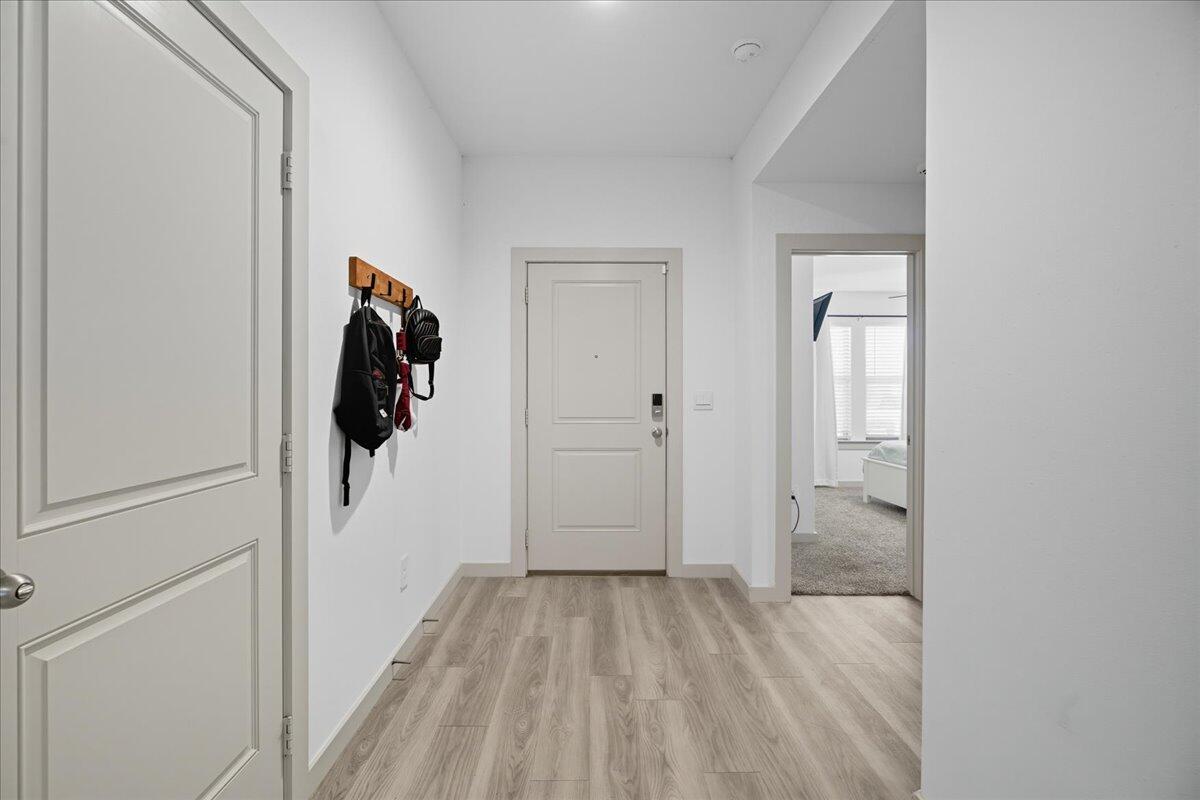 2309 149th Street Lubbock, TX 79423 - Photo 4 of 31 a view of a bathroom from a hallway