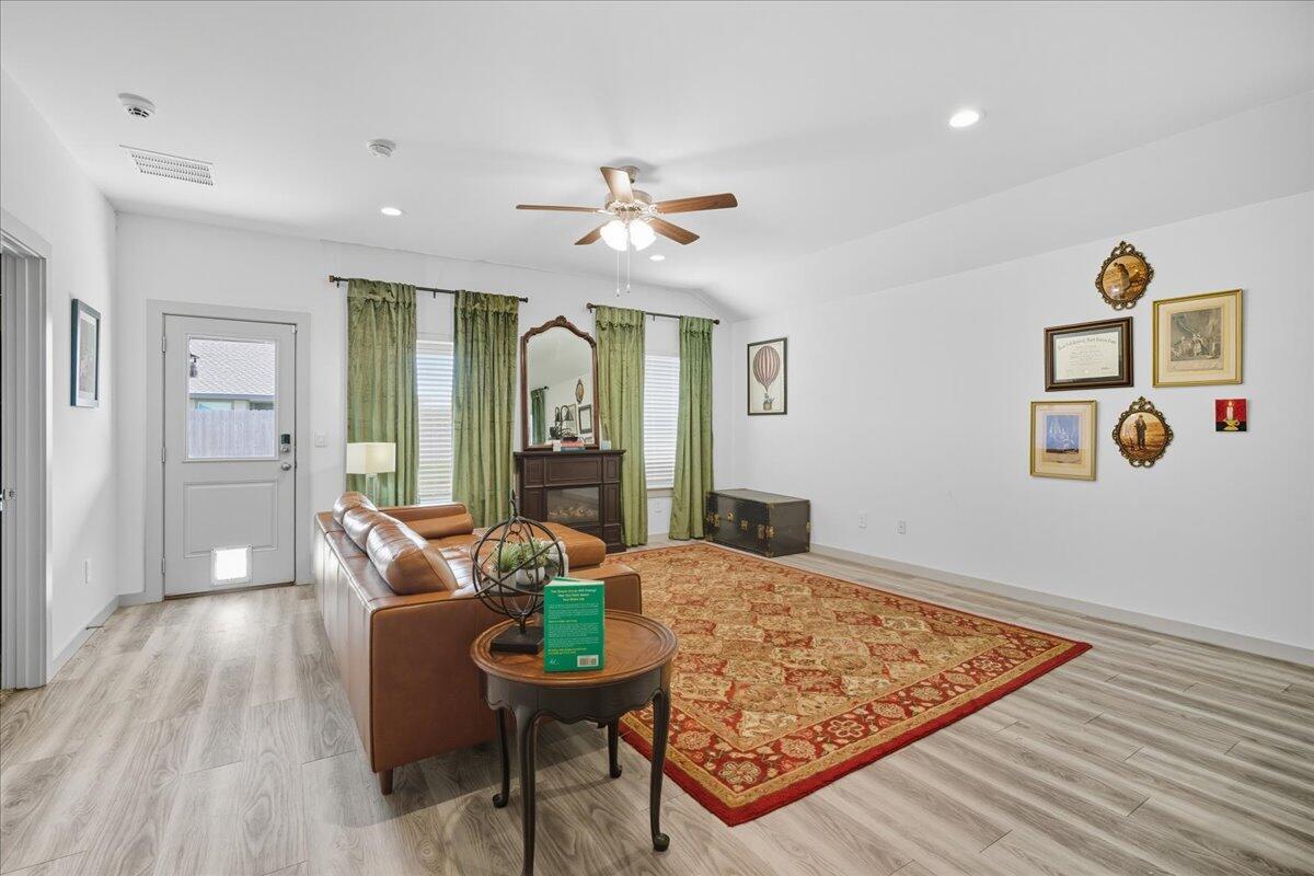 2309 149th Street Lubbock, TX 79423 - Photo 5 of 31 a living room with furniture and wooden floor