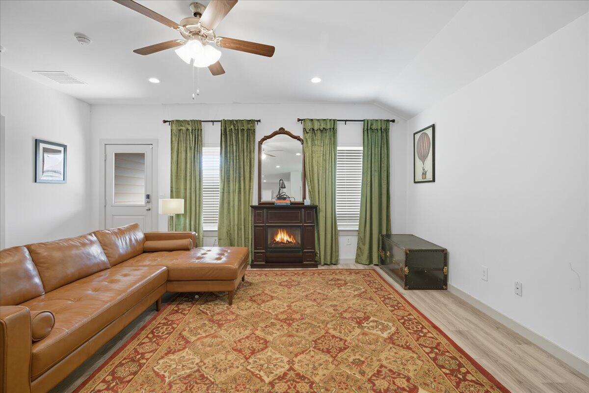 2309 149th Street Lubbock, TX 79423 - Photo 6 of 31 a bedroom with a large bed and a couch