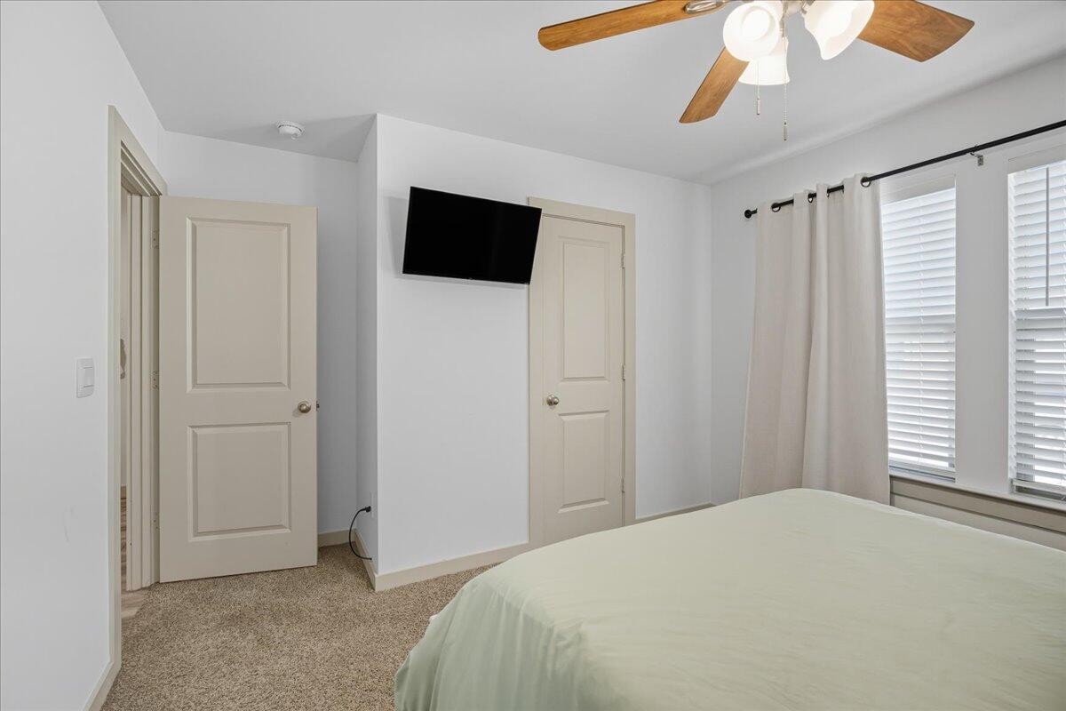 2309 149th Street Lubbock, TX 79423 - Photo 8 of 31 a bedroom with a bed and a television