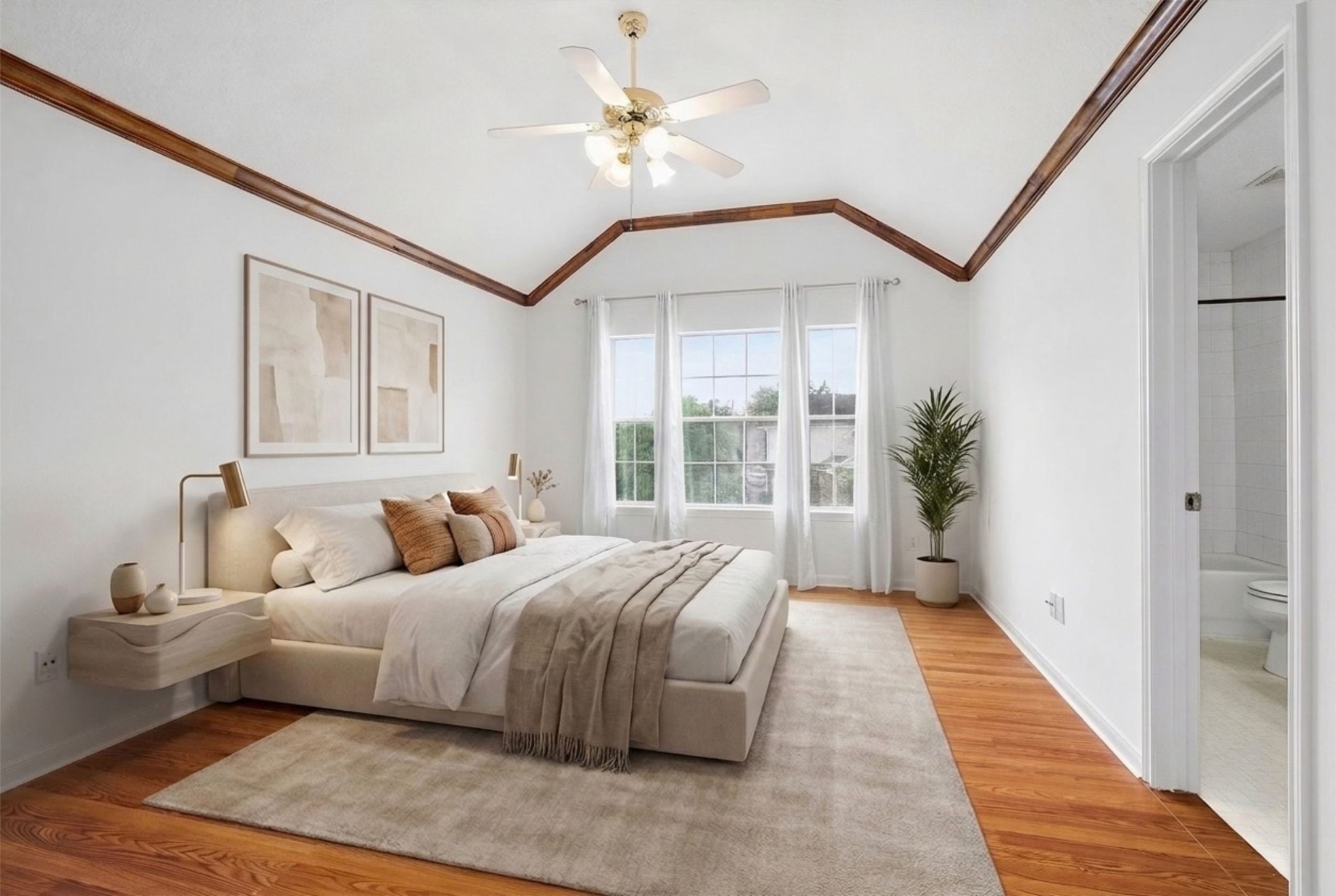 5426 Bourgeois Road Houston, TX 77066 - Photo 24 of 43 Experience the elegance of the primary bedroom, featuring vaulted ceilings, warm wood accents, and abundant natural light, creating a perfect blend of comfort and style. (Virtual Staging)