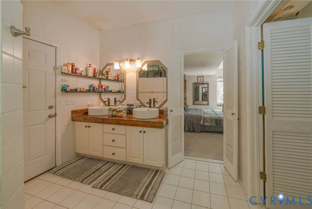 12700 Coalboro Road Chesterfield, VA 23838 - Photo 34 of 50 Bathroom with white tile flooring and walls