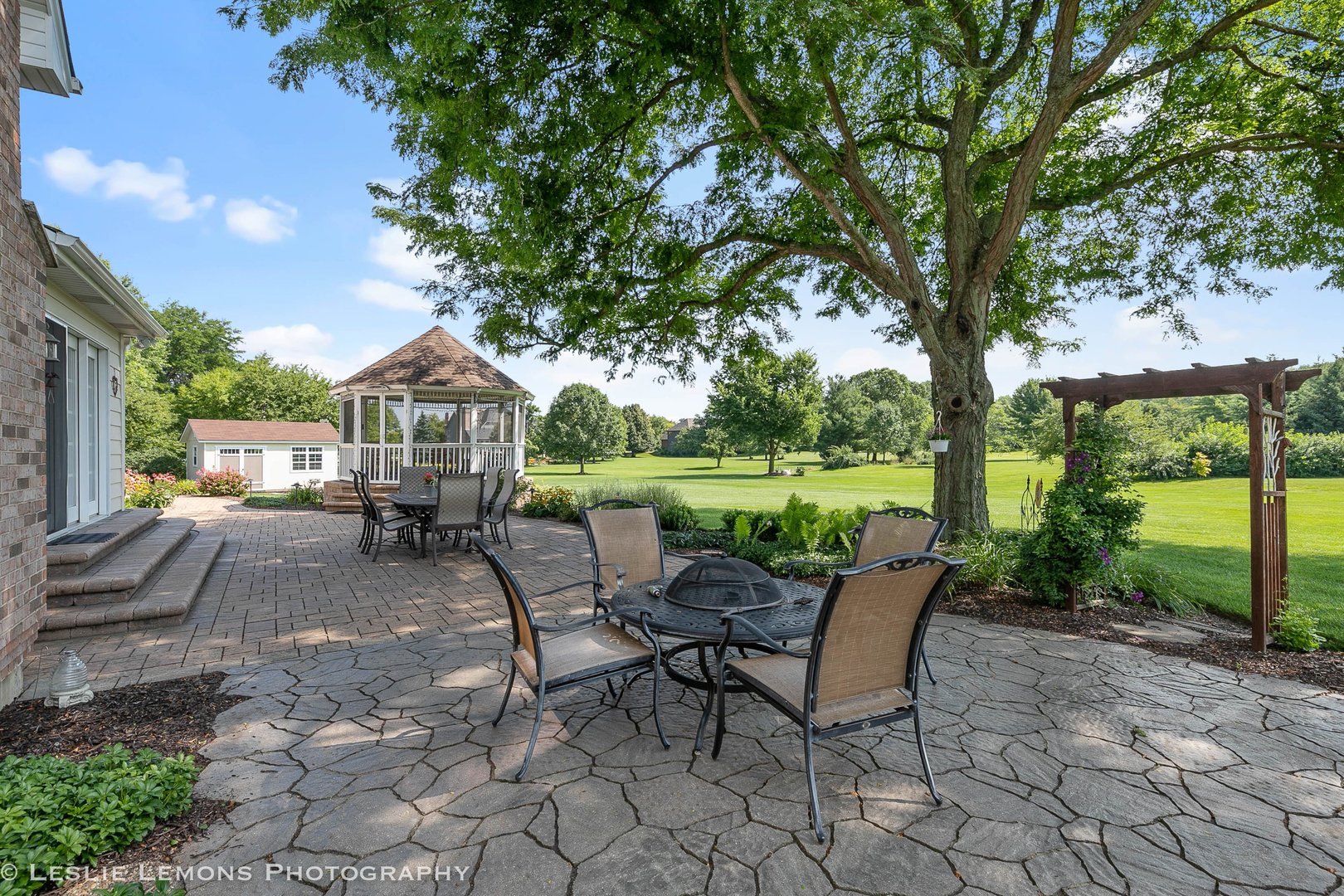 5N189 Grey Barn Road St. Charles, IL 60175 - Photo 4 of 15 a view of a patio with a table chairs and a backyard