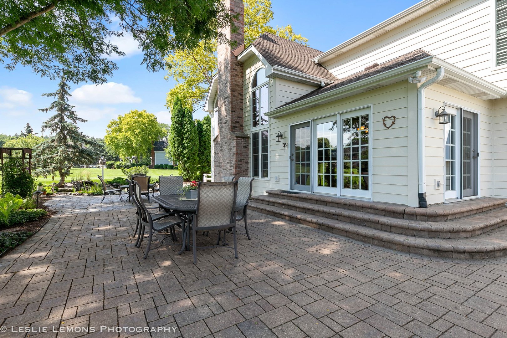 5N189 Grey Barn Road St. Charles, IL 60175 - Photo 5 of 15 a view of a patio with table and chairs and potted plants