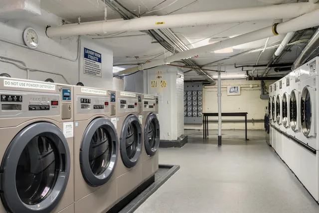 a view of a storage & utility room with racks shoes and chairs