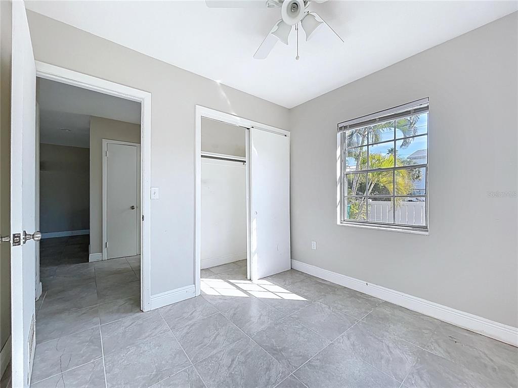 501 Spring Avenue Anna Maria, FL 34216 - Photo 18 of 49 an empty room with windows and closet