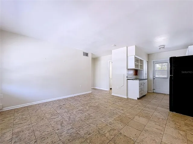a kitchen with stainless steel appliances kitchen island granite countertop a stove and a microwave