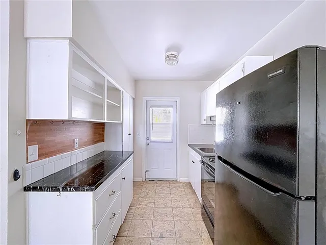 a view of a room that has a stove